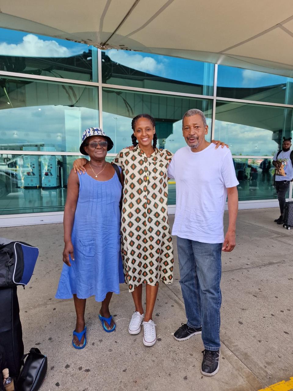 Anasia Reid standing with her parents